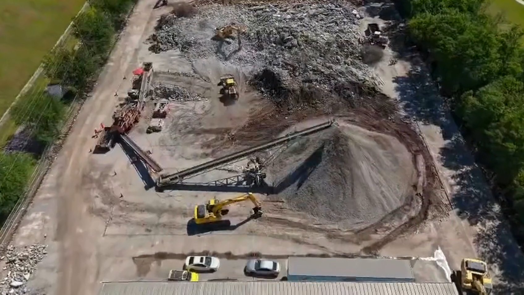 Rock and concrete crushing for removal at a Jacksonville demolition site